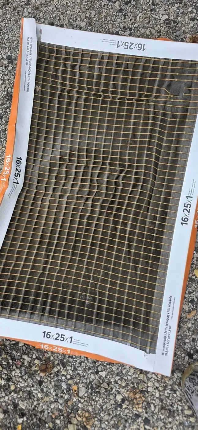 Severely dirt-clogged 16x25x1 furnace filter removed from a Fox Valley home