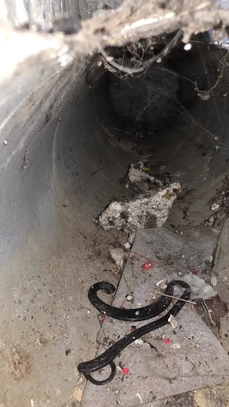 Debris and dust accumulation inside a supply duct before cleaning
